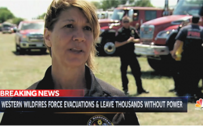 Western wildfires force evacuations, leave thousands without power